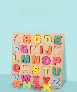 Macro detail of wooden alphabet puzzle board with colorful 3D letters for kids