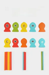 Detail of colorful wooden magnetic fish numbers and counting sticks for math learning