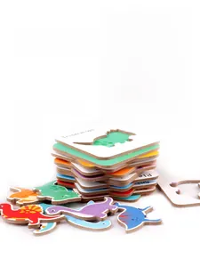 Detail of 2.6mm thick wooden dinosaur puzzle pieces showing high-quality sticker finish
