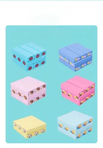 Close-up of wooden blocks with colorful animal patterns including ladybugs and bees