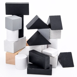 Educational wooden geometric building blocks set in minimalist black white and grey tones