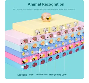 Macro detail of wooden animal stacking blocks with colorful patterns and printed names