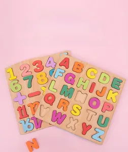 Macro shot of colorful wooden letters and numbers on a natural wood puzzle board for kids