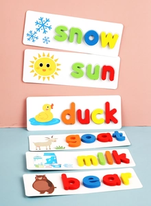 Macro view of wooden English alphabet puzzle cards with colorful 3D spelling blocks