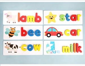 Detail view of colorful wooden letters and cartoon cards for spelling lamb, star, and bee