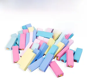 Macro detail of macaron-colored wooden stacking blocks with cute insect prints and water paint