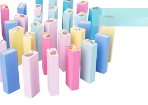 Close-up of pastel wooden blocks featuring cute bee and snail cartoon animal patterns