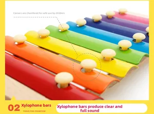 Macro detail of rainbow colored steel keys and smooth rounded edges on wooden xylophone
