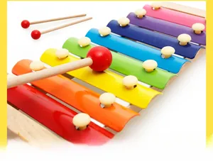 Detailed close-up of colorful 8-note wooden xylophone toy with two wooden mallets