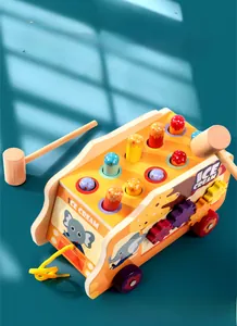 Close-up of wooden ice cream truck toy with colorful hitting pegs and side gears