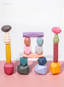 Macro view of macaron-colored wooden balancing blocks in geometric gemstone shapes
