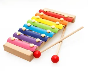 Detail of colorful 8-scale wooden xylophone for babies with two red-tipped mallets