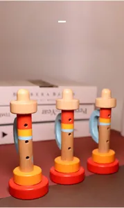 Close-up of colorful wooden trumpet toys with smooth finish for early childhood education