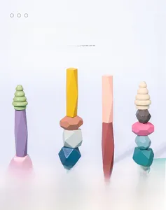 Detail of colorful wooden balancing blocks with smooth geometric facets for child play