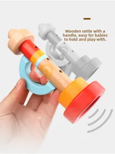 Close-up of wooden baby trumpet toy with colorful paint and ergonomic blue handle