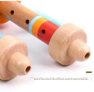 Macro detail of natural wood texture and smooth finish on kids wooden trumpet recorder