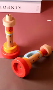 Close-up of wooden toy trumpets featuring eco-friendly water-based paint for toddlers