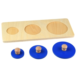 Montessori wooden puzzle with three blue circles of different sizes and wood handles