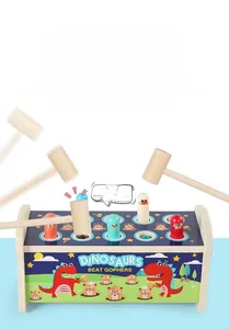 Macro detail of dinosaur-themed wooden hammer toy with colorful sliding gophers