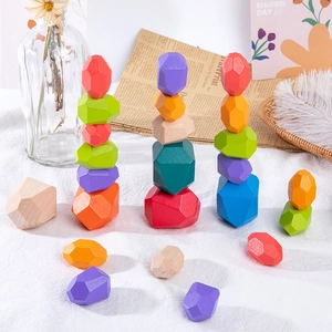 Detail shot of colorful wooden balance stones for kids hand-eye coordination training