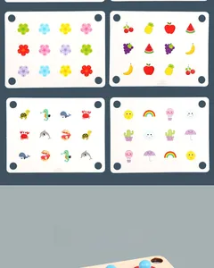 Detail view of four wooden memory game cards featuring colorful animal and fruit patterns