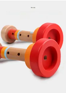 Detailed macro view showing the smooth wood texture and vibrant painted finish of wooden toy horns