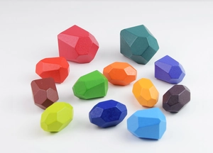 Detailed view of 12 colorful wooden balancing stones for children educational play
