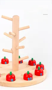 Close-up of wooden apple tree toy with numbered pieces for toddler math learning