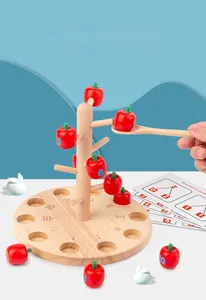 Close-up of wooden apple picking toy with math learning cards for preschool children
