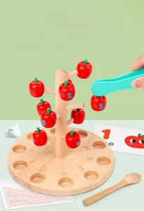 Detail of children's wooden apple counting toy with numbers and pincer tool for math learning