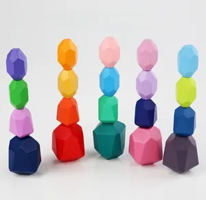 Detail of colorful wooden stacking balancing stones with eco-friendly painted surfaces