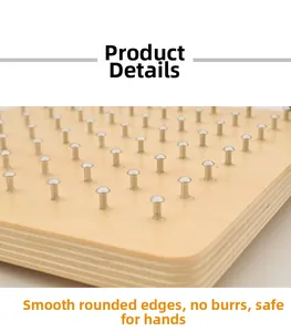 Close-up of a wooden geoboard with smooth rounded edges and polished metal pins