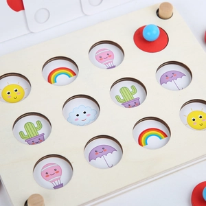Educational wooden memory game for kids with cartoon icons and blue peg pieces on white back