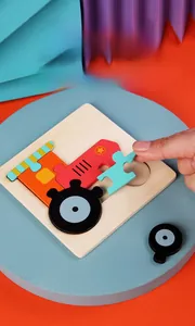 Vue détaillée d'un puzzle en bois 3D de camion de chantier rouge pour l'éveil des enfants