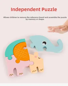 Gros plan d'un enfant assemblant un puzzle éléphant en bois 3D coloré pour l'éducation
