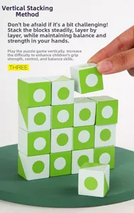 Close-up of hand assembling green wooden building blocks to train balance and grip