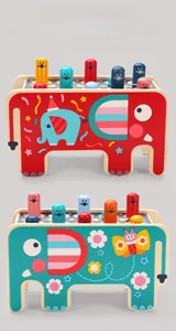 Detail of double-sided wooden elephant pound-a-mole toy with colorful cylinders