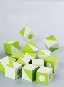 Macro detail of beechwood geometric blocks with green patterns and smooth wood texture