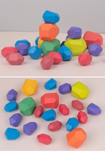 Detailed flat lay of colorful multi-faceted wooden balancing stones for kids
