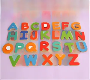 Close-up of 26 colorful wooden alphabet letters for educational word spelling and learning