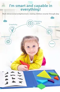 Detailed view of child playing with colorful magnetic tangram puzzles and guide book