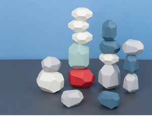 Close-up of multicolored wooden balance stones in various geometric shapes for kids