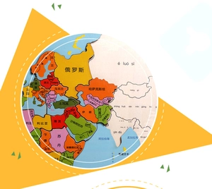 Macro detail of wooden world map puzzle with bilingual Chinese and Pinyin geography labels