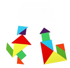 Detail of wooden magnetic tangram puzzle pieces forming human and boat figures