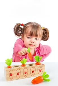 Toddler playing with Montessori wooden carrot toy showing size matching and number learning