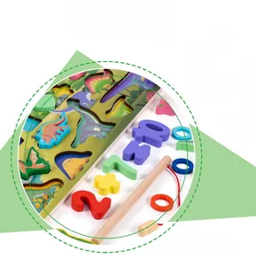 Detail of wooden dinosaur puzzle pieces, magnetic fishing rod, and arithmetic numbers
