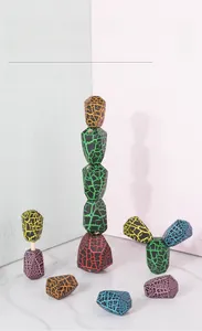 Close-up of colorful wooden stacking blocks with unique crackle finish and slot design