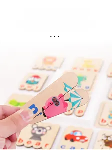 Detail of wooden alphabet puzzle sticks featuring cartoon koala and car for toddler learning
