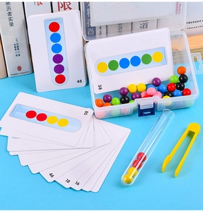 Detail view of colorful beads, test tube, tweezers, and logic cards for sensory motor training