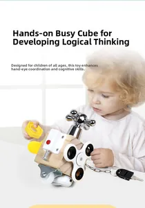 Close-up of a toddler playing with a wooden busy cube featuring locks and metal knobs